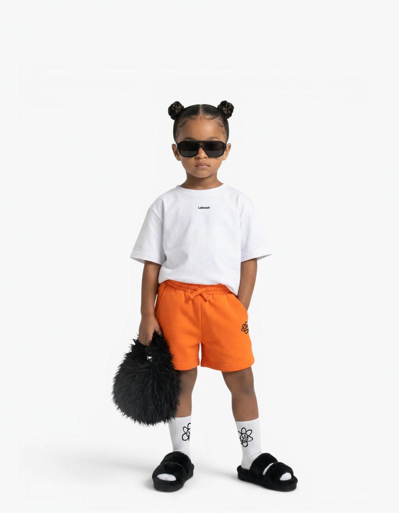 Orange Shorts for girls by Laboosh, front view on a white background