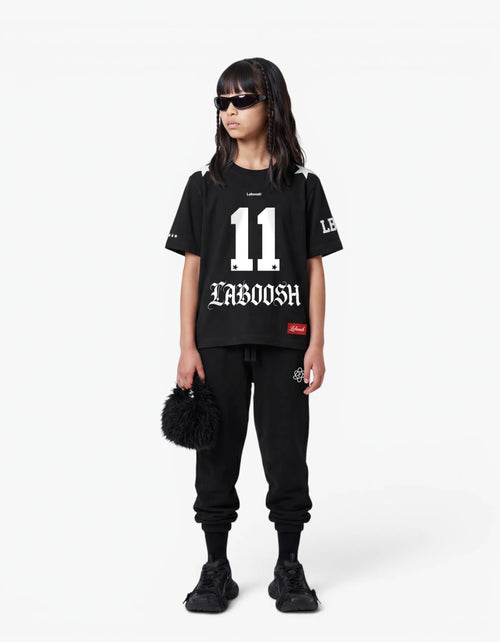 Black t-shirt from the 11:11 Make a Wish, front view, with a signature Laboosh™ print, on a white studio backdrop.