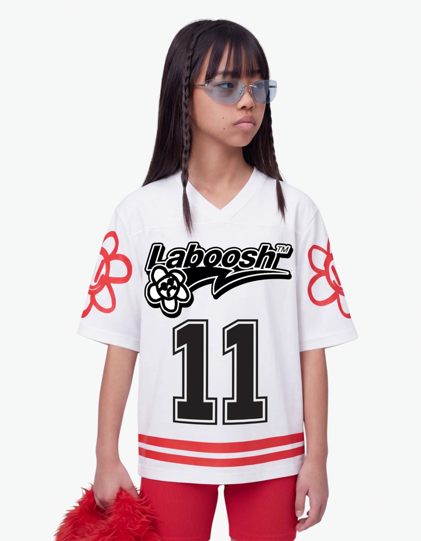 Girl in white baseball tee from 11:11 Make a Wish, half-body view, with a signature Laboosh™ print, styled with matching 11:11 Make a Wish pieces.