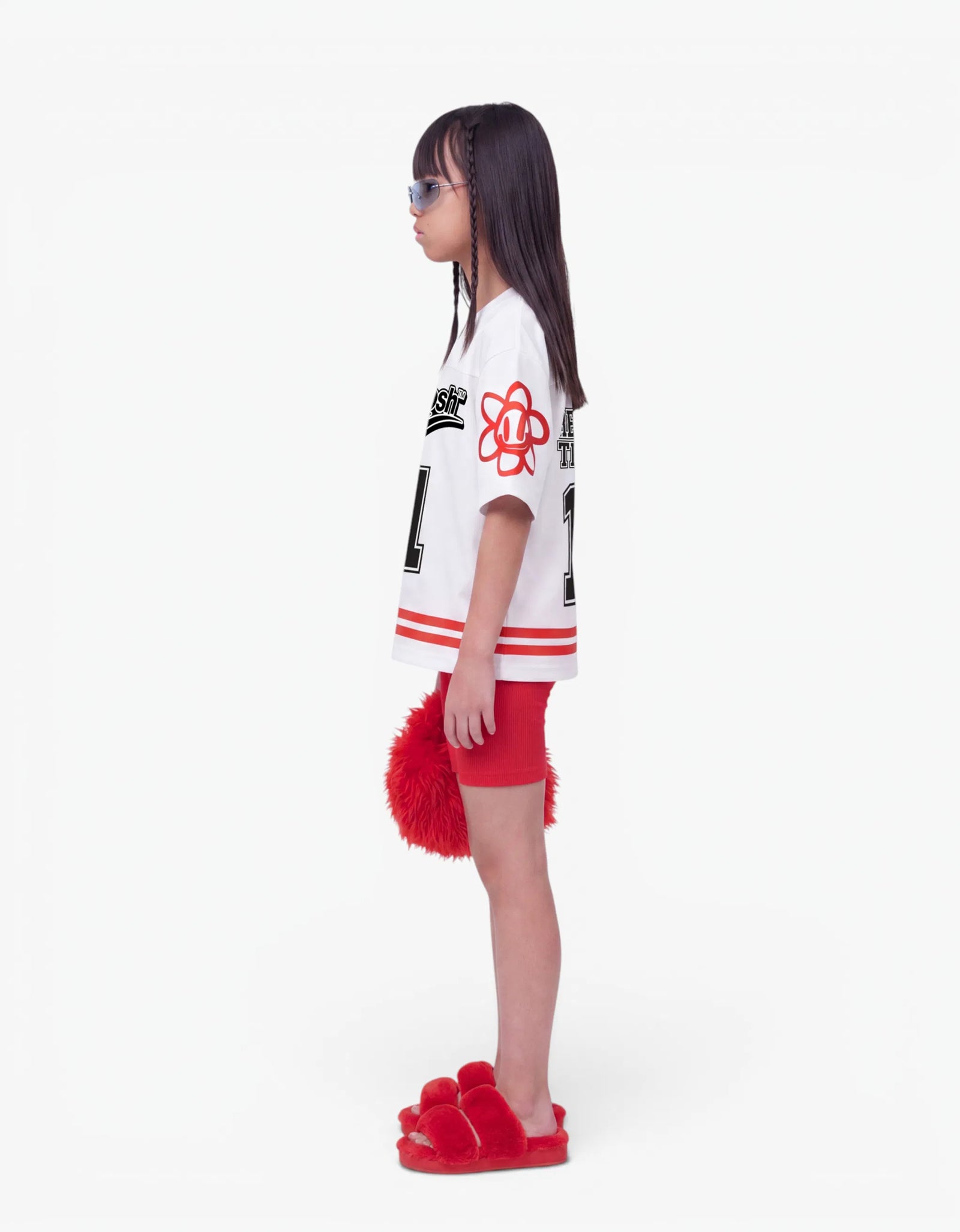 White baseball tee for girls, side view, with a signature Laboosh™ print, photographed on a plain white background.