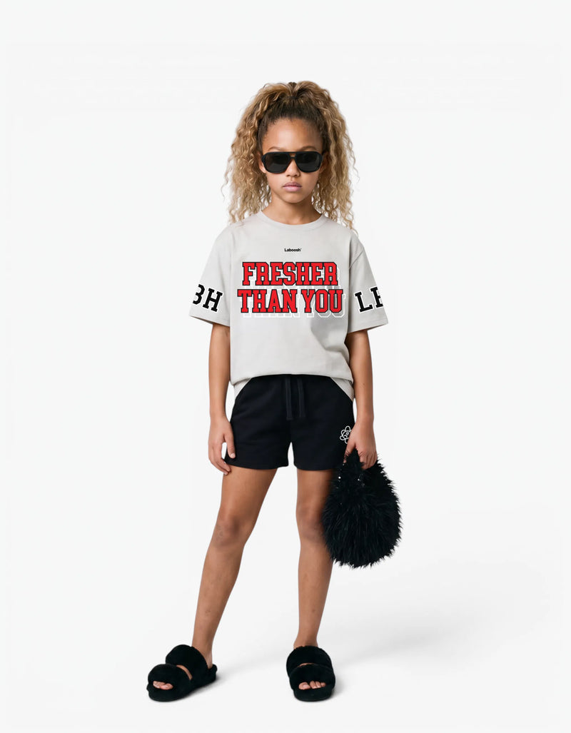 Cream t-shirt from the Rib Collection, front view, with a signature Laboosh™ print, on a white studio backdrop. — alt view