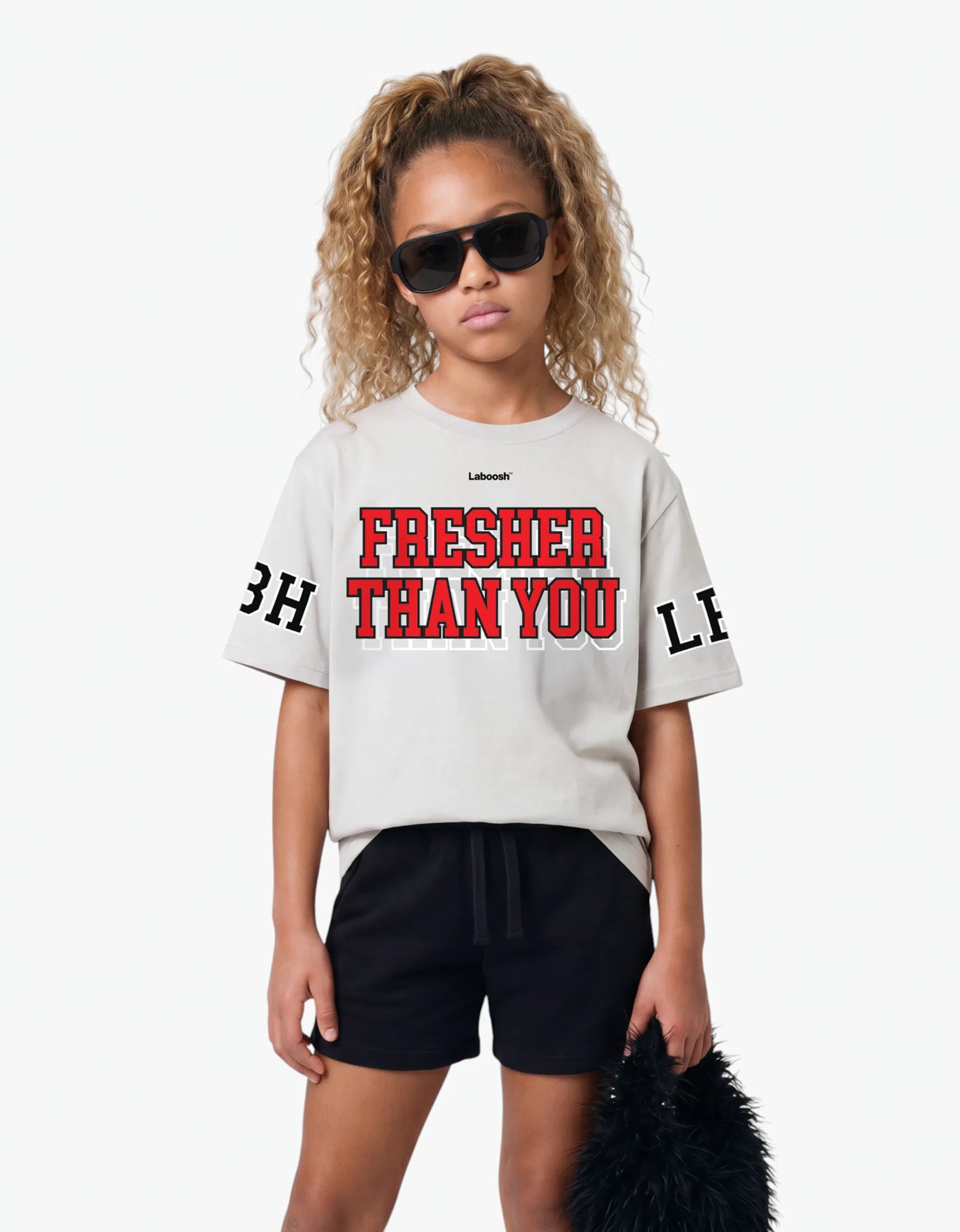 Cream t-shirt from the Rib Collection, front view, with a signature Laboosh™ print, styled with matching Rib Collection pieces.