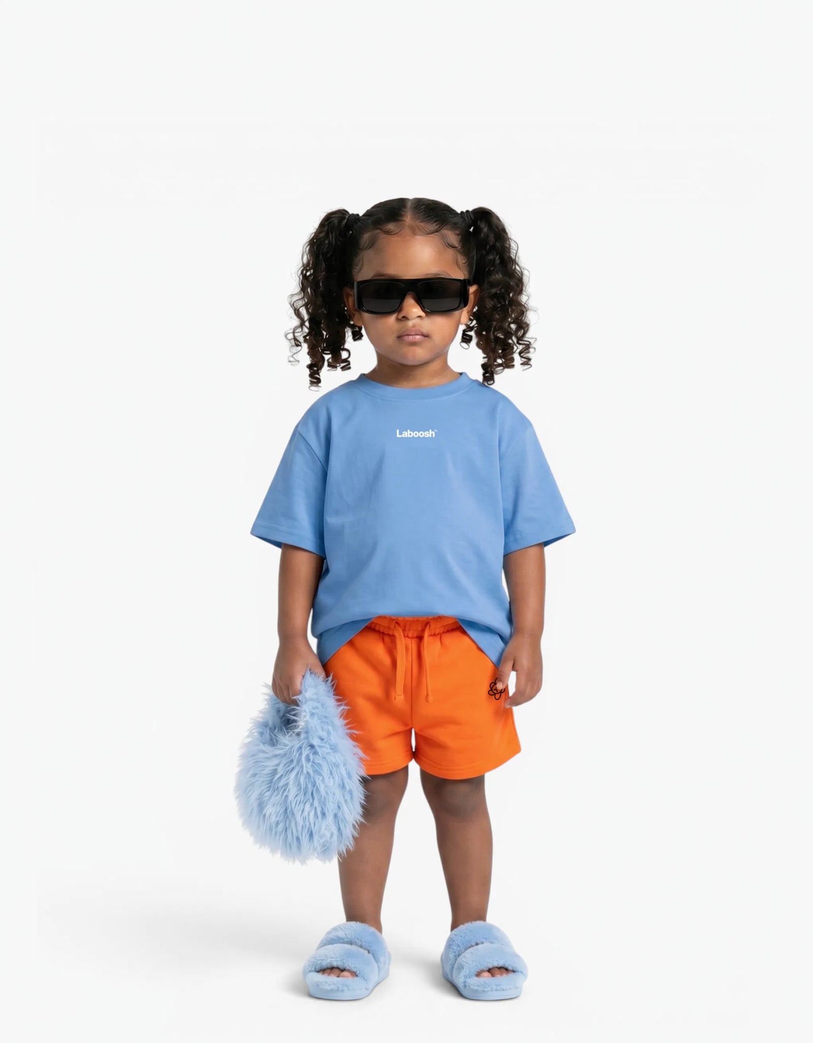 Orange Shorts for girls by Laboosh, front view on a white background