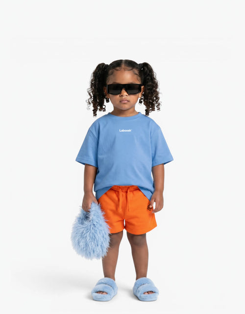 Orange Shorts for girls by Laboosh, front view on a white background