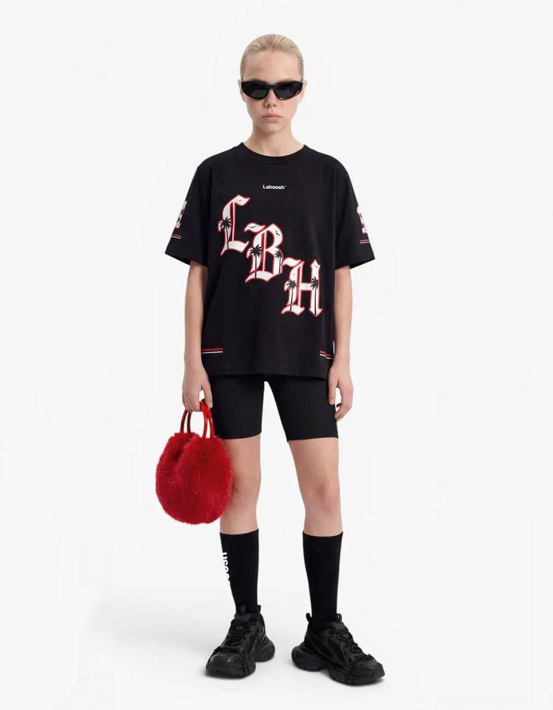 Girl wearing black t-shirt, front view, with a signature Laboosh™ print, against a bright white background. — alt view