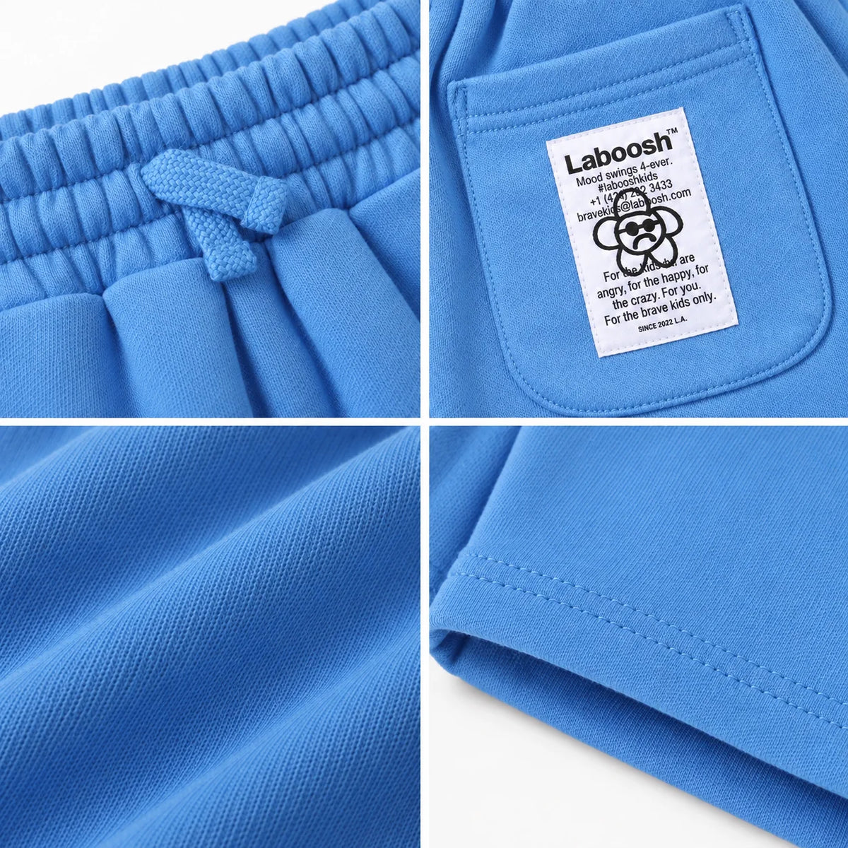 Sugarberry boys shorts craftsmanship details: drawstring waistband, Laboosh back-pocket label, cotton fabric and hem stitching.