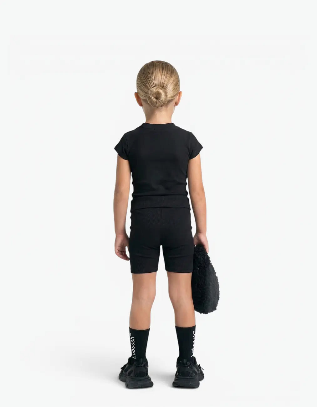 Black ribbed two-piece set on a girl, back view, featuring Laboosh™ branding on the chest, styled with matching MoodSwings pieces.