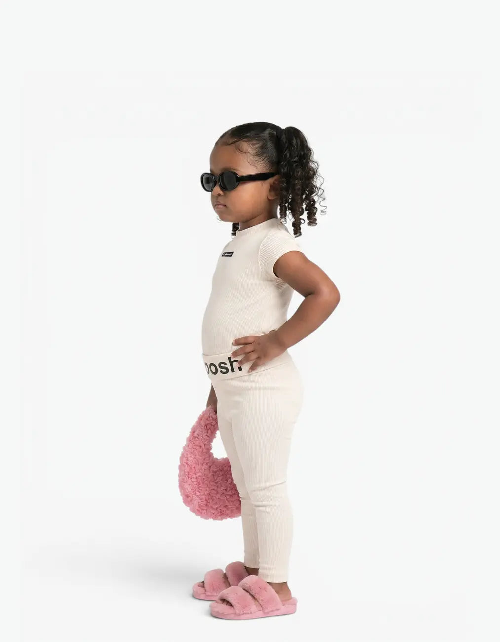 Cream ribbed two-piece set for girls, side view, with Laboosh™ branding on the chest, photographed on a clean white backdrop.