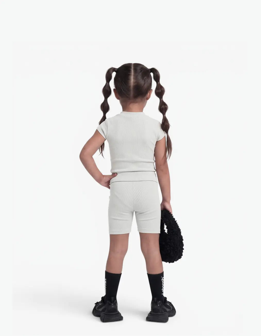 Grey ribbed two-piece set, back view — Laboosh™ branding on the chest, photographed on a clean white backdrop, keeping its shape all day.