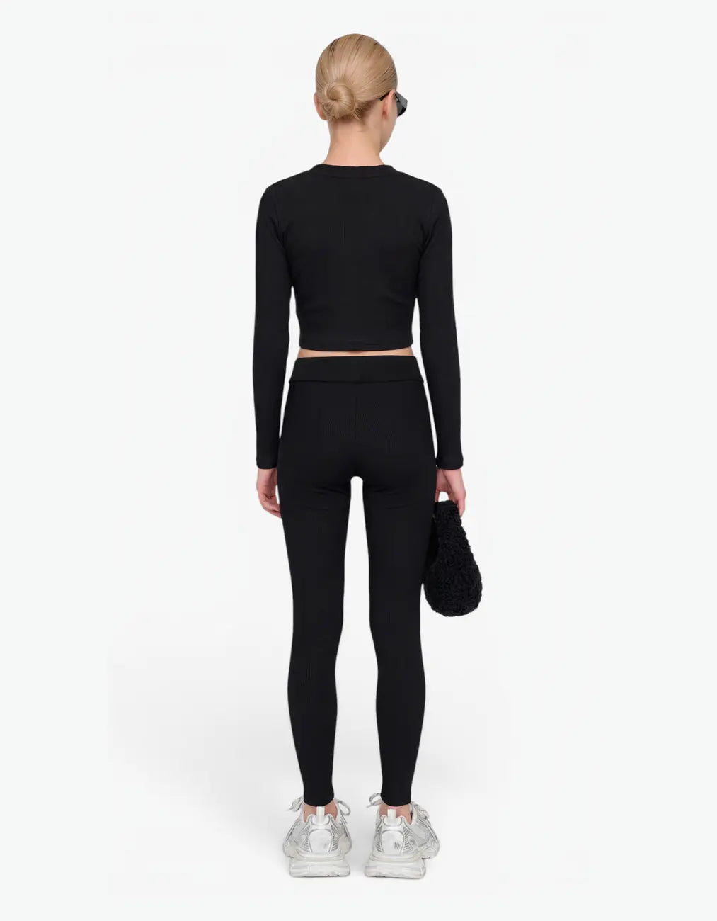 Black ribbed crop top for girls, back view, long-sleeve with a fitted cropped ribbed-knit silhouette, on a white background