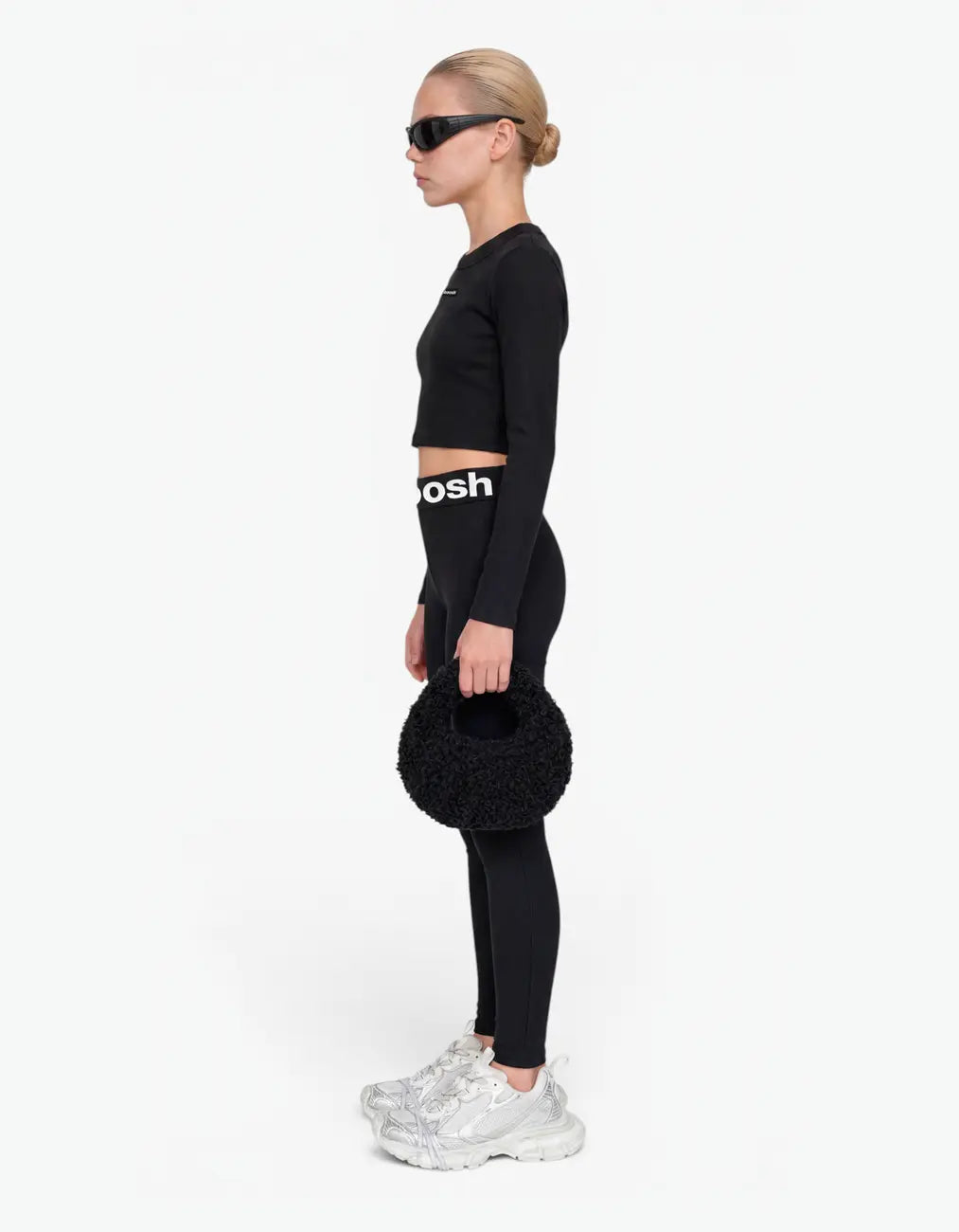 Black ribbed long leggings for girls, side view, with Laboosh logo waistband and matching crop top on a white background