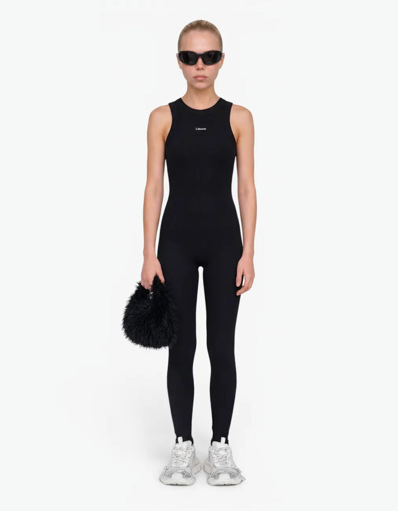 Black ribbed romper with long pants for girls with Laboosh logo, front view on white background