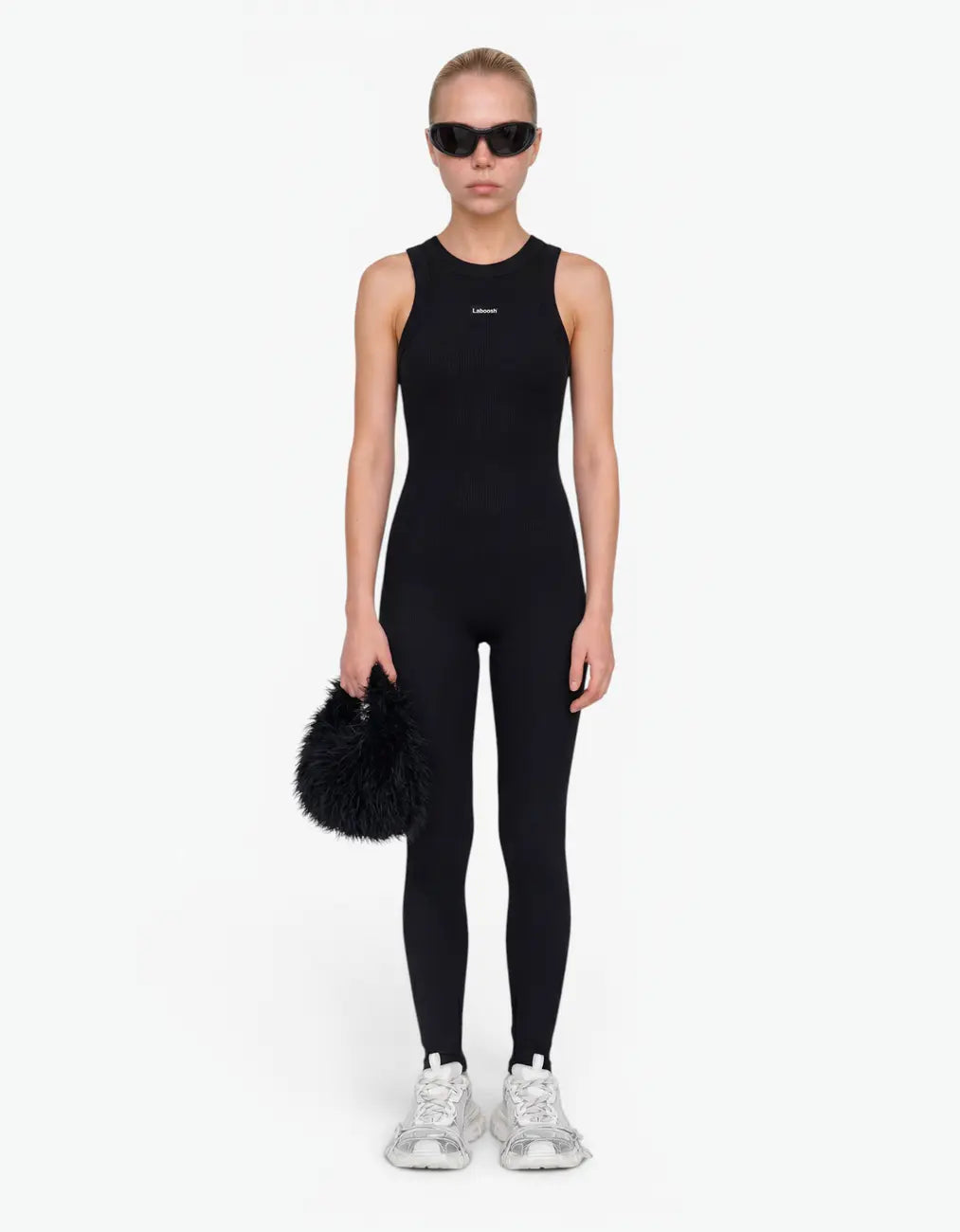 Black ribbed romper with long pants for girls with Laboosh logo, front view on white background