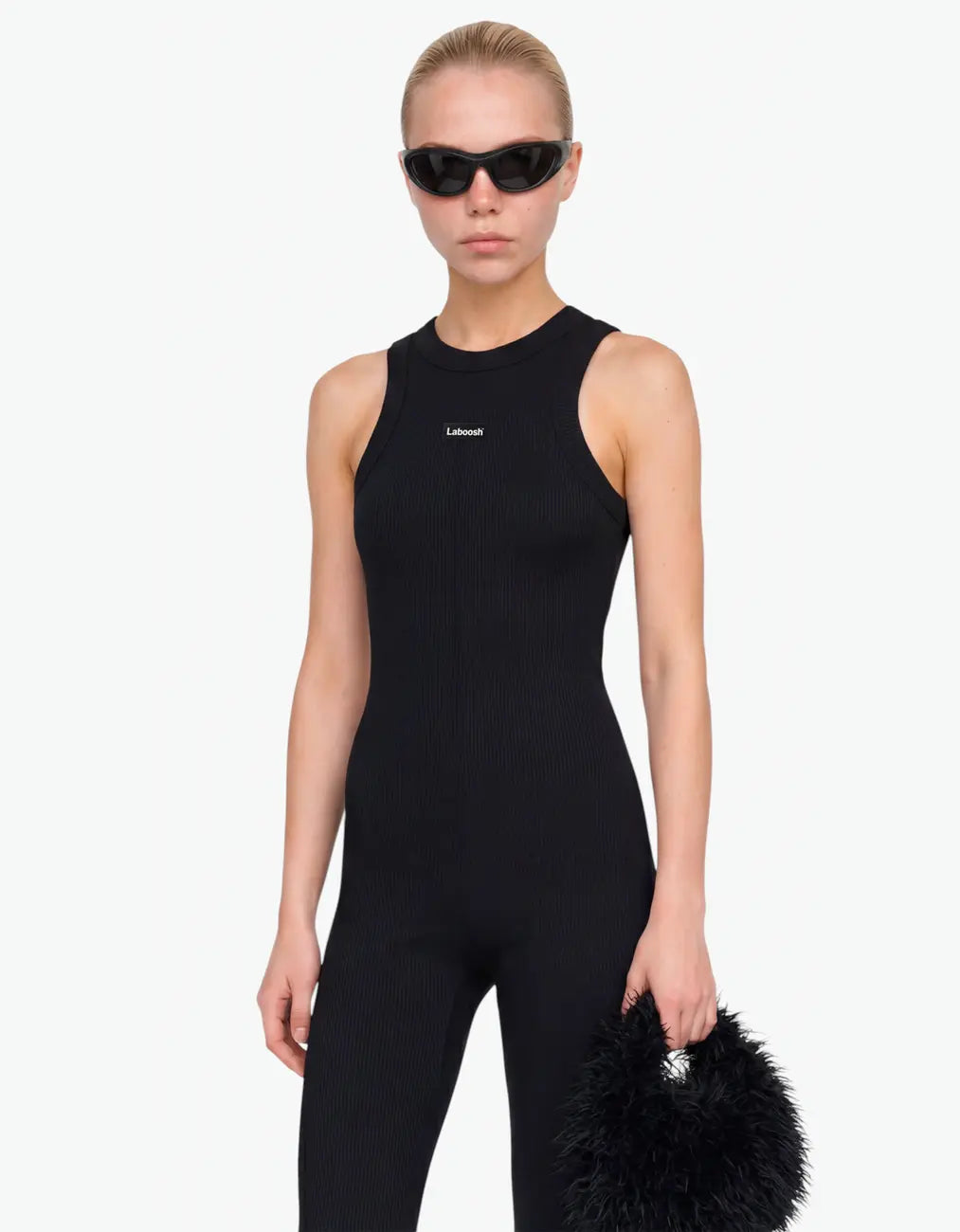 Black ribbed romper for girls with Laboosh logo, half-body close-up on white background
