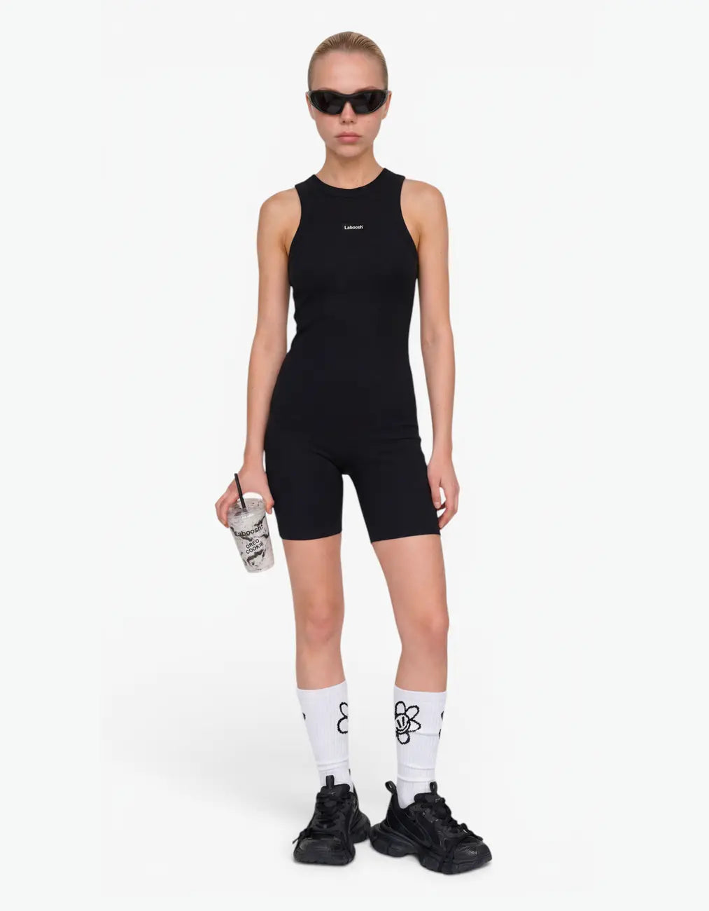 Black ribbed short romper for girls with Laboosh logo, front view on white background