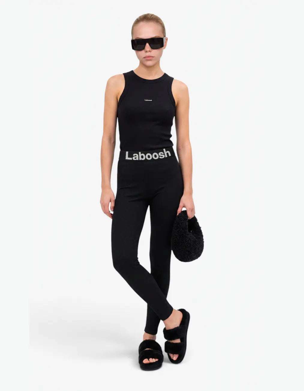 Black ribbed tank top for girls by Laboosh™, front view, sleeveless ribbed-knit racer-style tank styled with matching black ribbed leggings and Laboosh™ logo waistband on a white background