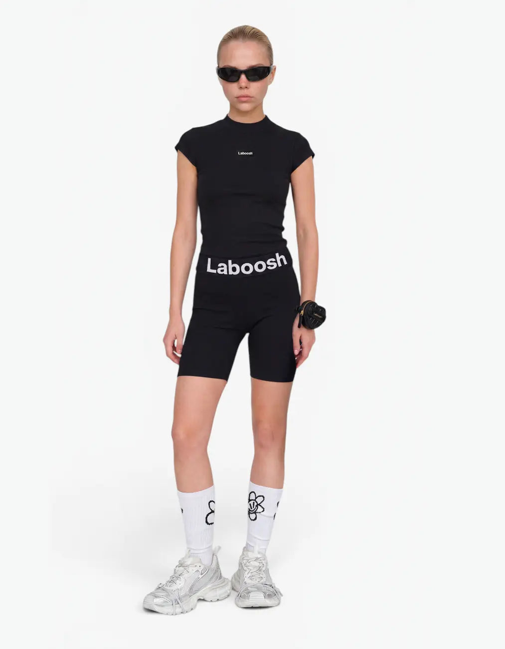 Black ribbed biker leggings for girls with Laboosh logo waistband, front view on white background