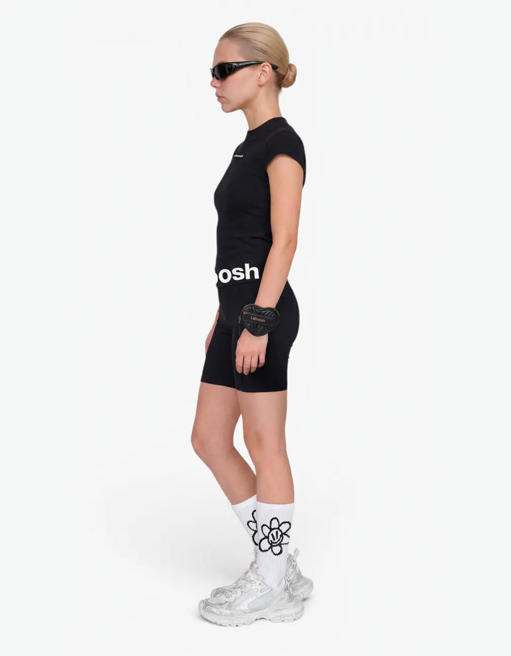 Black ribbed biker leggings for girls with Laboosh logo waistband, side view on white background