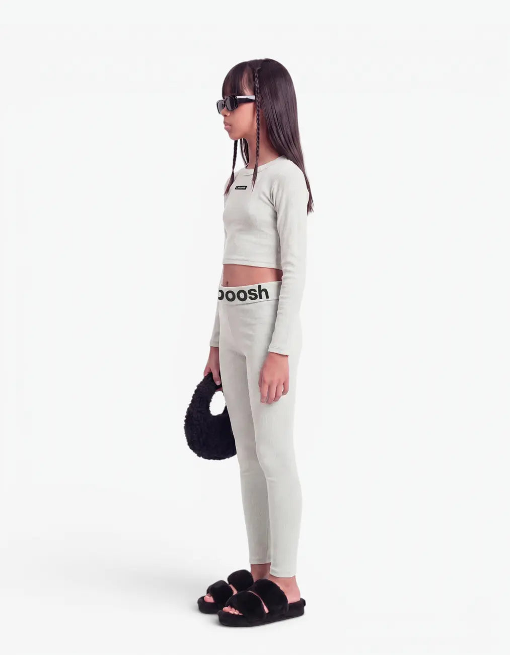 Grey ribbed crop top for girls by Laboosh™, side view, long-sleeve cropped ribbed-knit top with matching grey leggings and Laboosh™ logo waistband on a white background