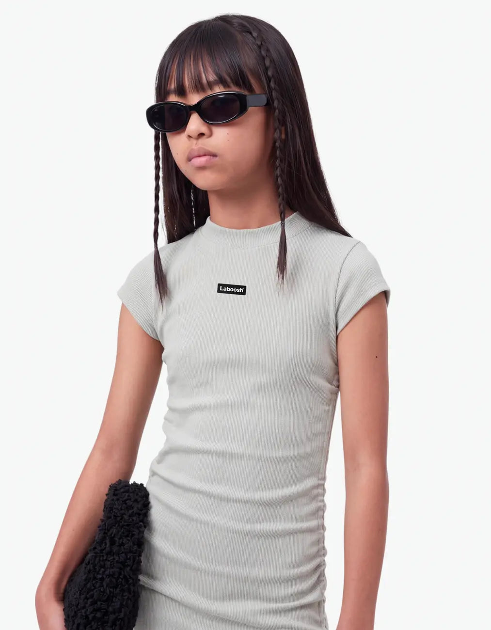 Close-up half-body view of a grey ribbed ruched dress with the Laboosh™ logo on the chest, girls' short-sleeve dress on a white background