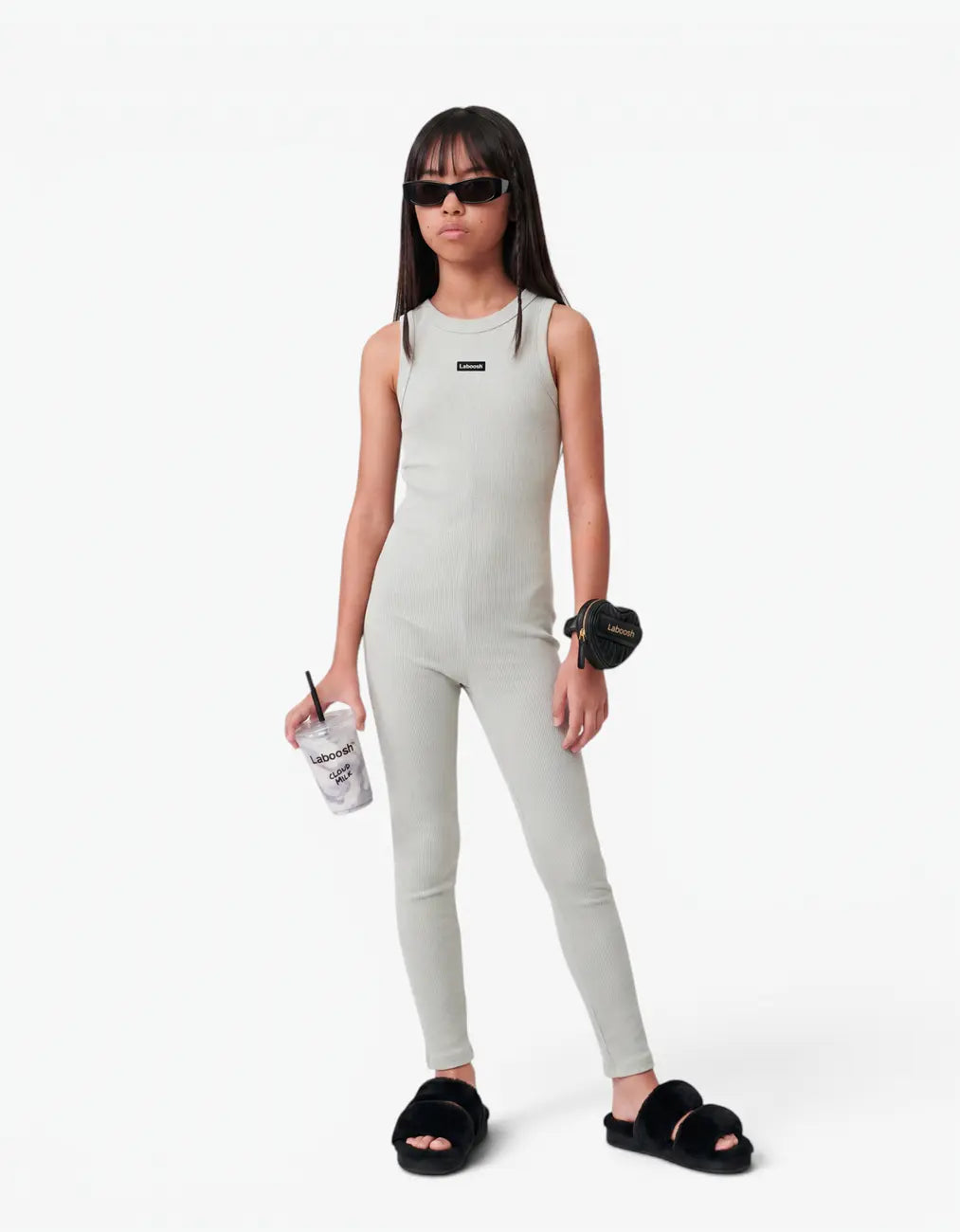 Grey ribbed romper with long pants for girls with Laboosh logo, front view on white background