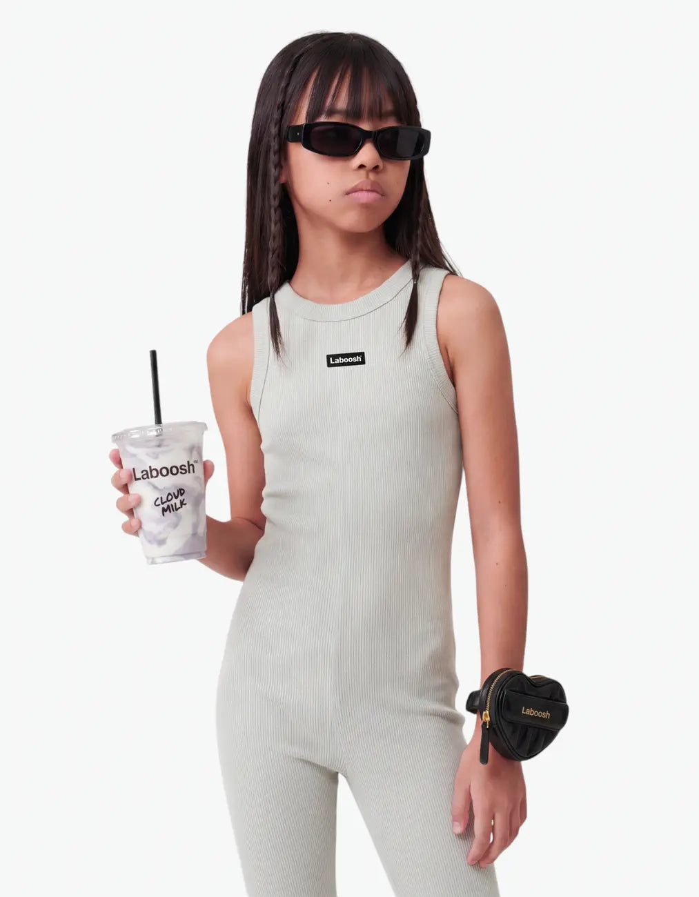 Grey ribbed romper for girls with Laboosh logo, half-body close-up on white background