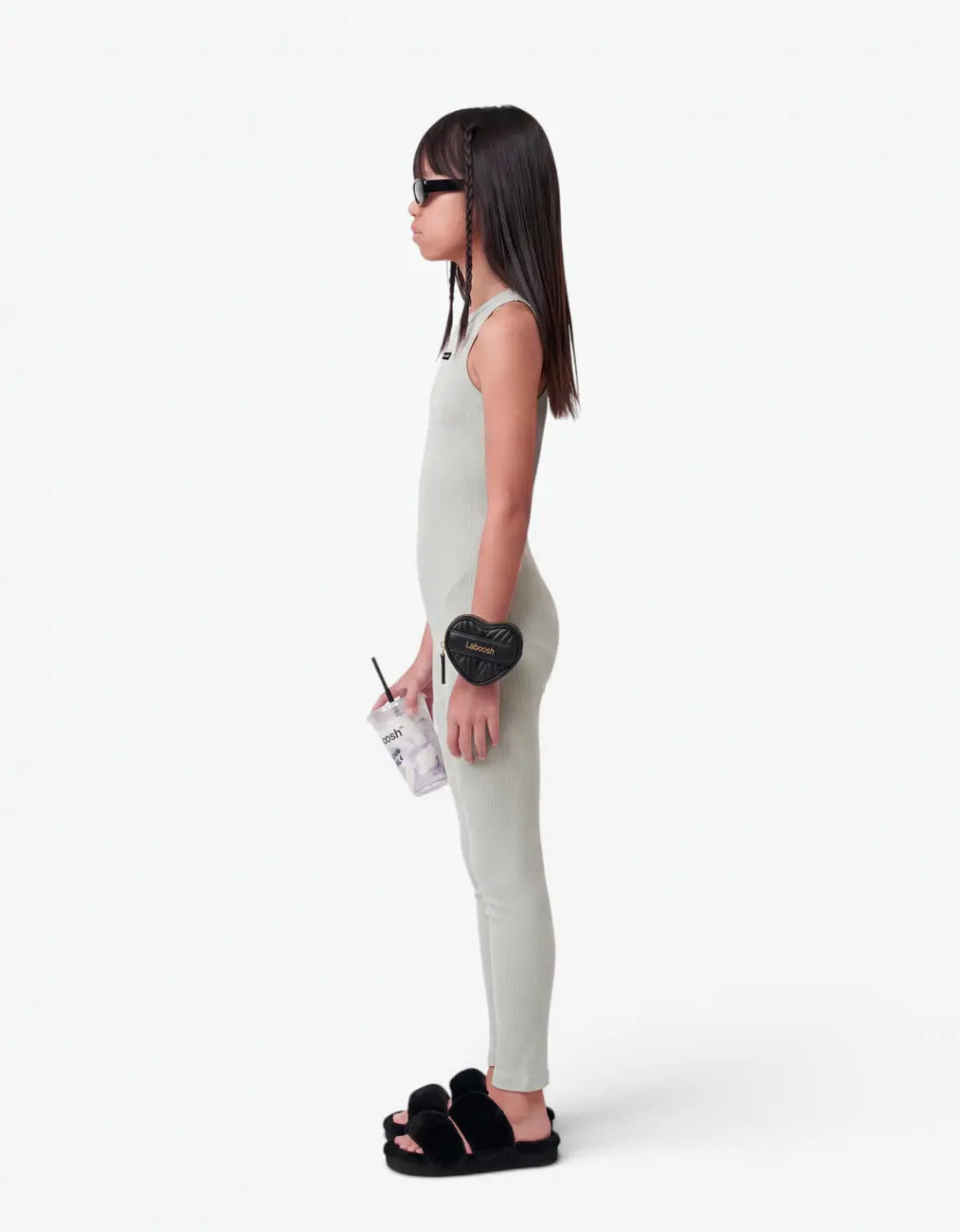 Grey ribbed romper with long pants for girls, side view on white background