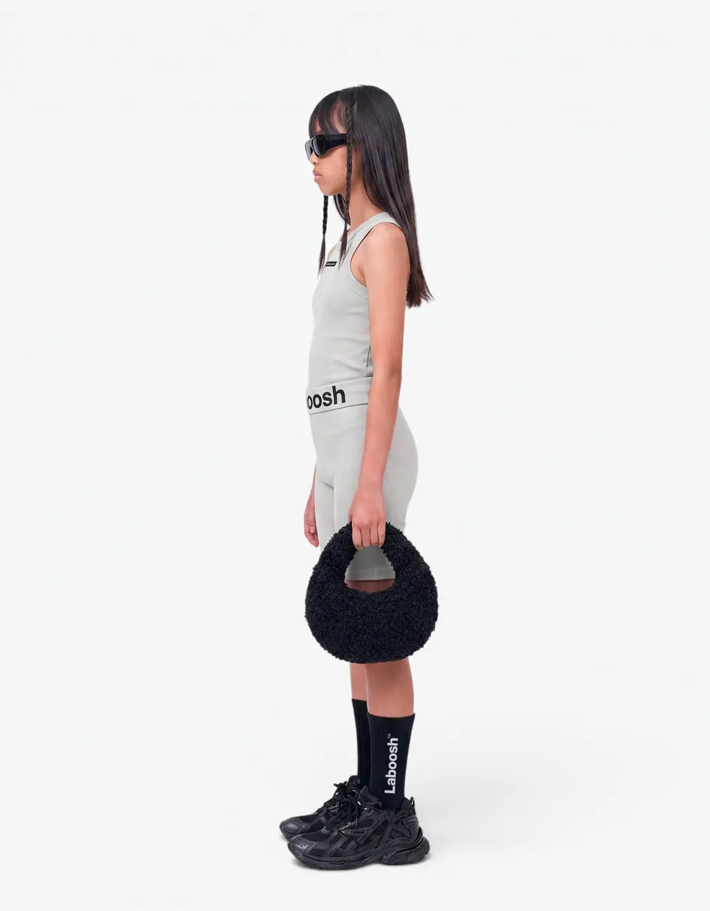 Grey ribbed tank top for girls, side view on white background