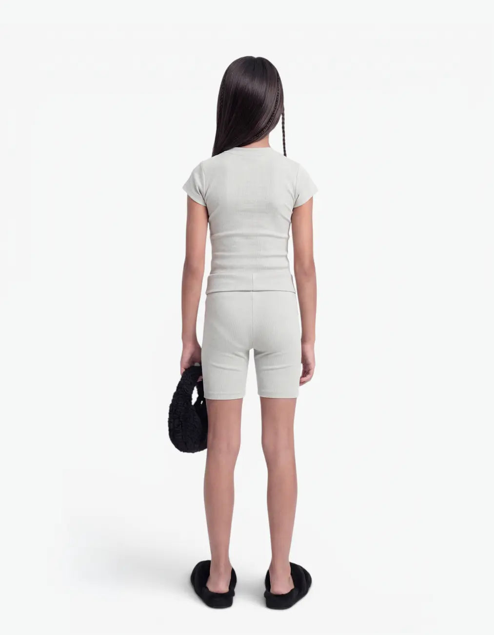 Grey ribbed biker leggings for girls, back view on white background
