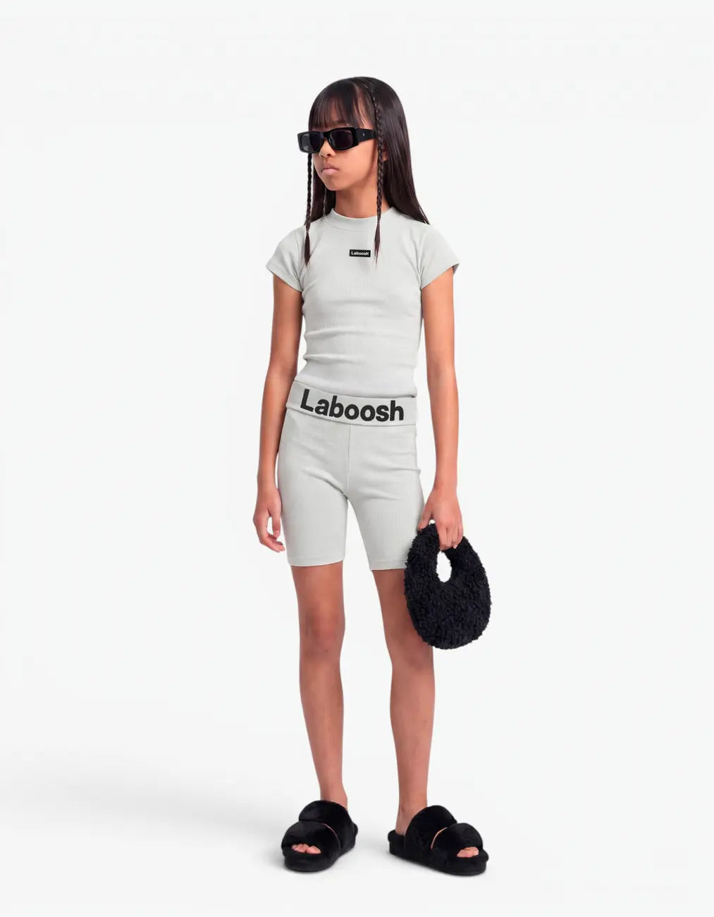 Grey ribbed short sleeve top from the Rib Collection, side view, with the Laboosh™ logo on the chest, on a clean white background.