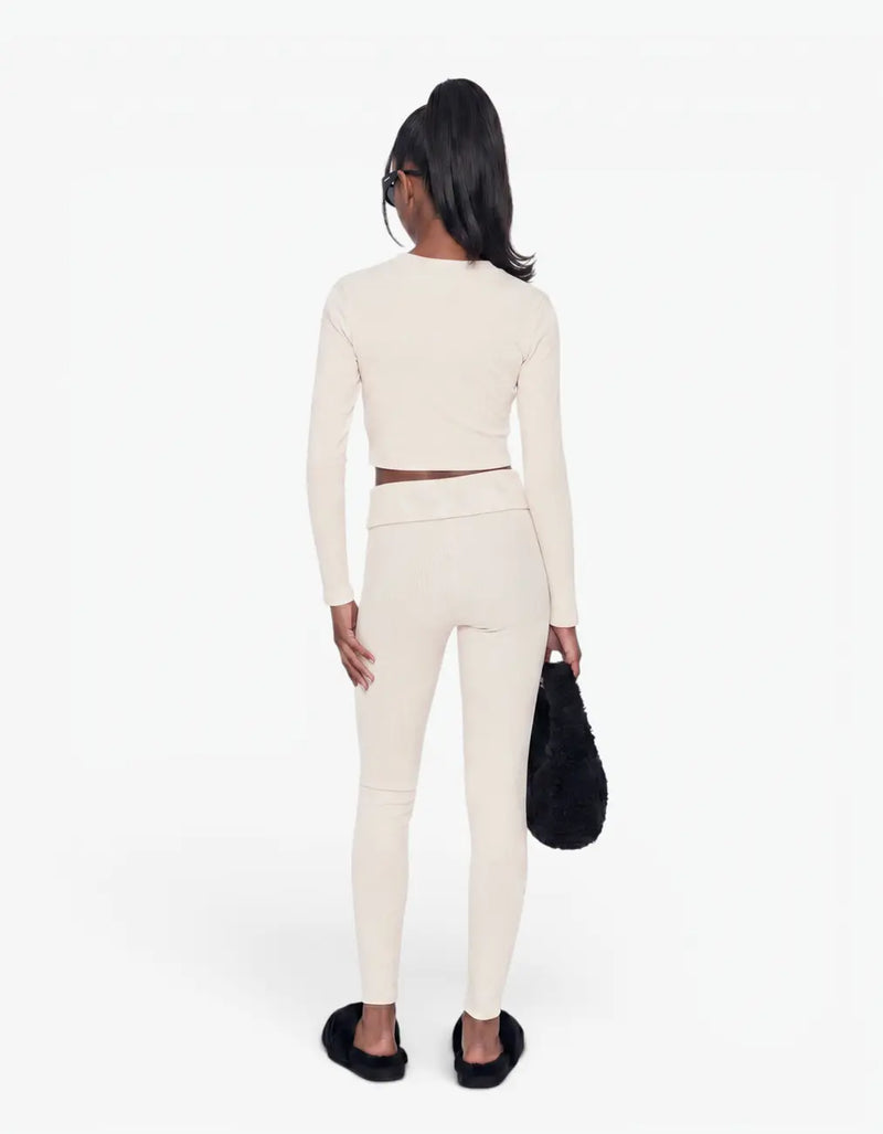 Cream ribbed long leggings for girls, back view, worn with a matching long-sleeve ribbed crop top, Laboosh™ branding, on a white background — alt view
