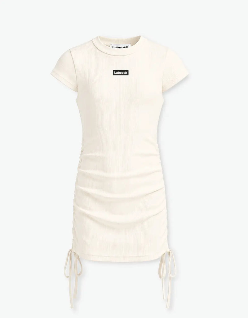 Cream ribbed ruched dress flat front product shot with the Laboosh™ logo on the chest and side ties, on a white background — alt view