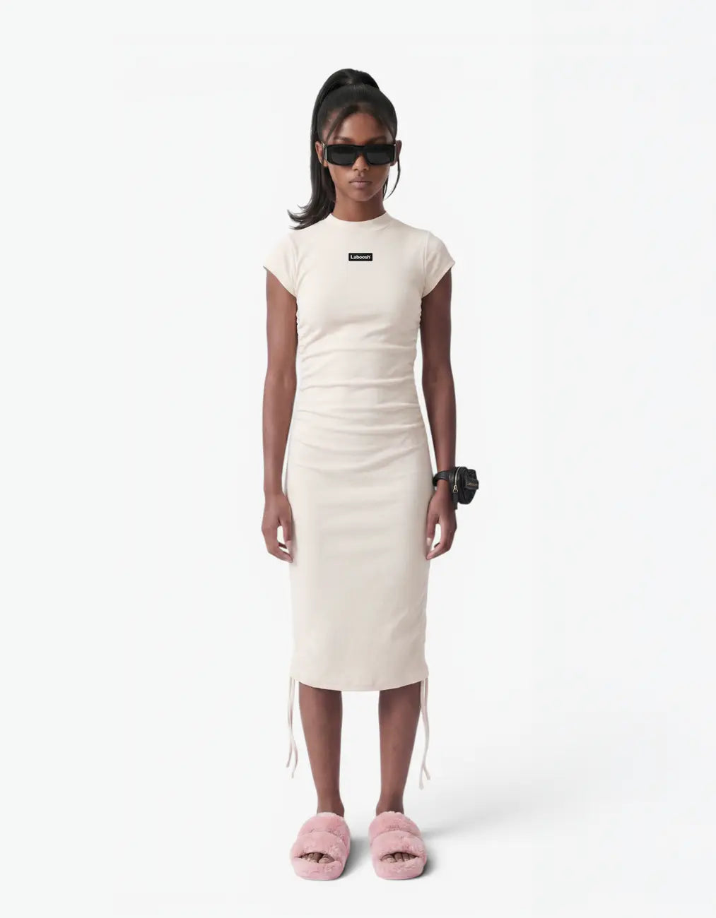 Cream ribbed ruched dress for girls, front view, with the Laboosh™ logo on the chest, on a white background
