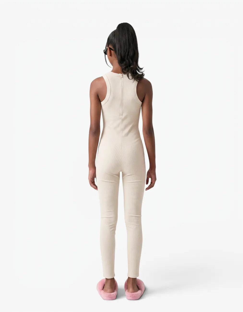 Cream ribbed romper with long pants for girls, back view on white background