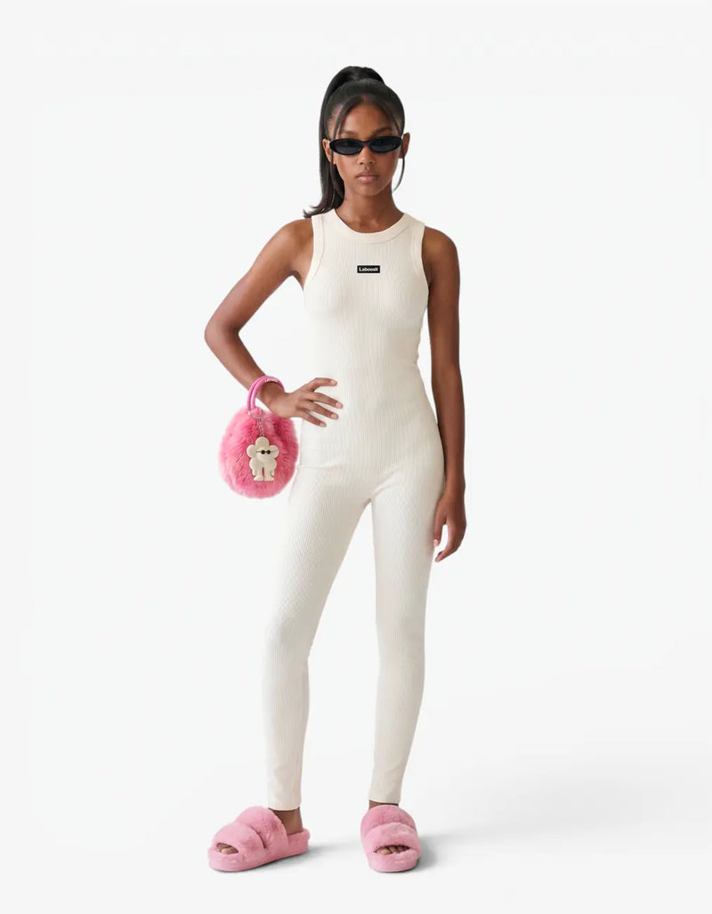 Cream ribbed romper with long pants for girls with Laboosh logo, front view on white background