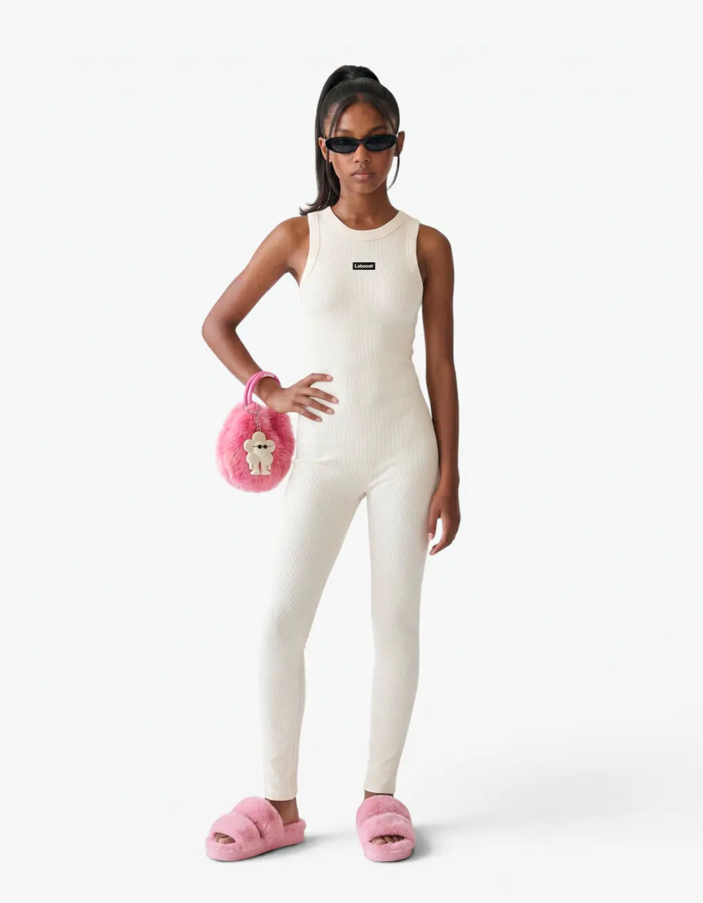 Cream ribbed romper with long pants for girls with Laboosh logo, front view on white background
