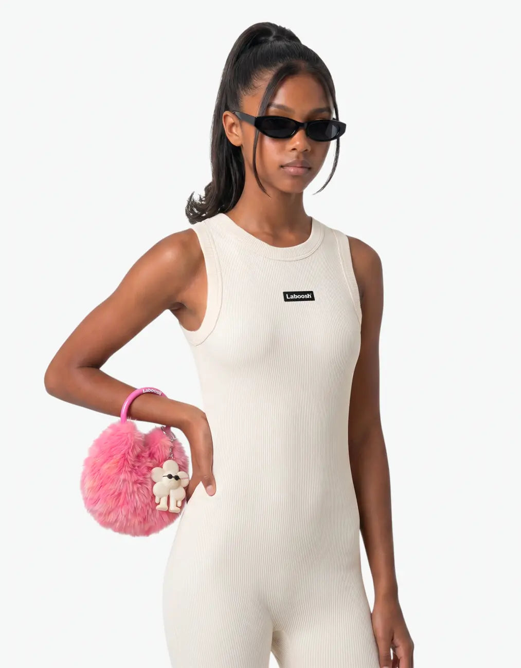 Cream ribbed romper for girls with Laboosh logo, half-body close-up on white background