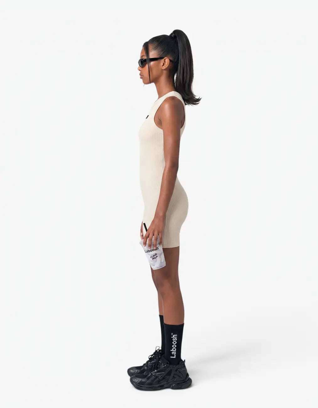 Cream ribbed short romper for girls, side view on white background