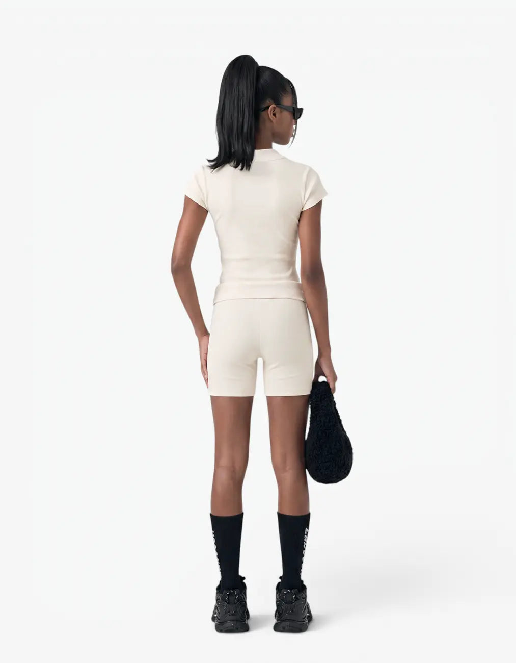 Cream ribbed biker leggings for girls, back view on white background